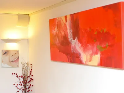 Corridor with a large red abstract painting and smile photography