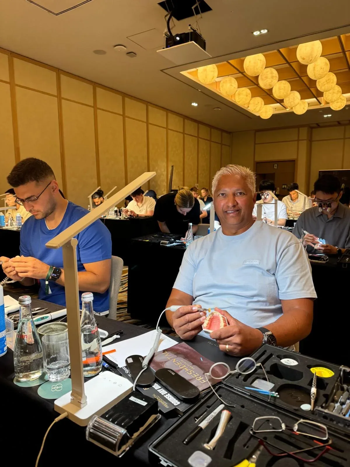 Dr Neresh Behari at work during a composite bonding course